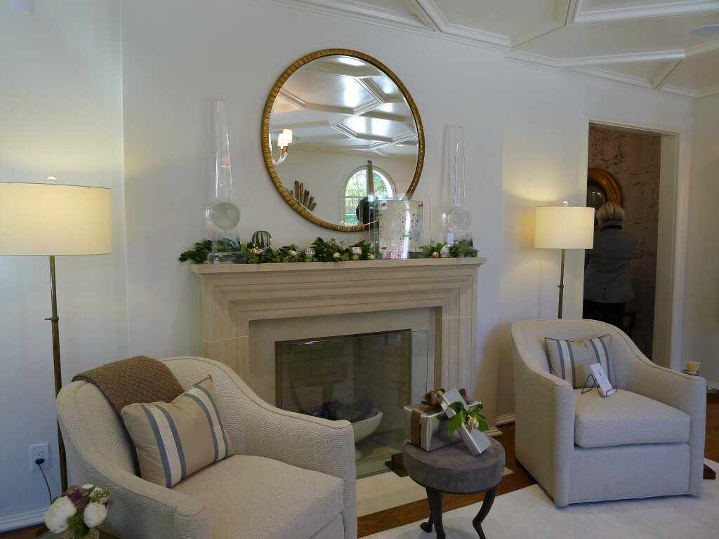 Garland enhances with ornaments and candles accents the mantel. Make sure that candles aren't at risk of setting the garland on fire.c e